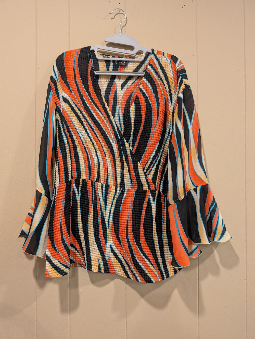 Milano Multicolor Flare V-neck Blouse- Orange, Black, Tan & Blue Wave Print, 1X